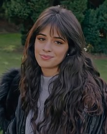 Headshot of Cabello with her hair down facing the camera