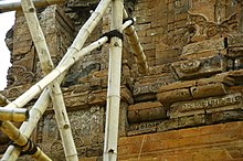 Remnants of the original bricks, showing details of brick work ornamentations. Candi Gunung Gangsir C.JPG