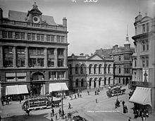 The Bank Buildings, along the left of the image, circa 1900 Castle Junction, Belfast (21272542969).jpg