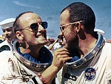 US astronauts Pete Conrad and Gordon Cooper after their safe return to Earth from space mission Gemini 5 in 1965. Pilot Conrad is jokingly instructing his commander Cooper to say Cheese to the photographers. Charles "Pete" Conrad and Gordon Cooper joking after landing of Gemini 5.jpg