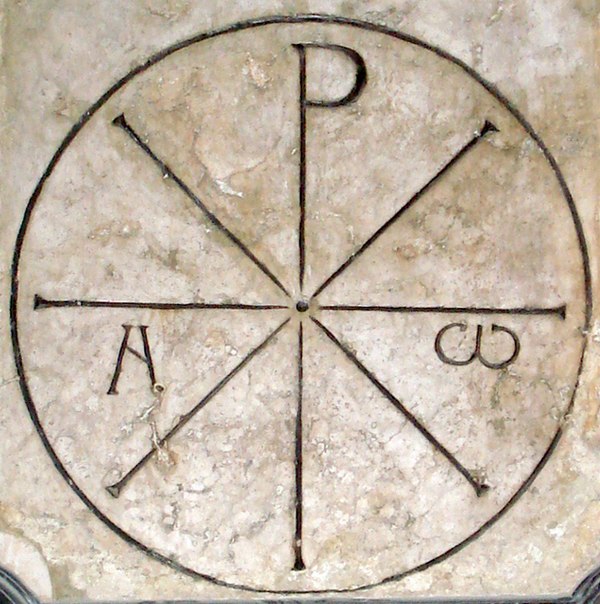 The so-called "Chrismon of Saint Ambrose" (Chrismon Sancti Ambrosii), on display on the eastern wall of Milan Cathedral, a Chi-Rho combined with Alpha