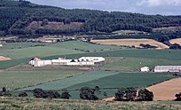 This photograph was taken in the late 1970s from Tertowie farm. The wooded hill in the distance is Tyrebagger Hill.