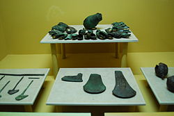 Copper bells, axe heads and ornaments from various parts of Chiapas (1200-1500) on display at the Regional Museum in Tuxtla Gutierrez, Chiapas. CopperBellsAxesOrnamentsTuxtla.JPG