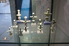 Chalcolithic cruciform figurines found in Lemba. These are made from picrolite and on display in Gallery 1. Cypriot Cruciform Figurines in Cyprus Museum.JPG