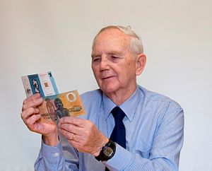 David Solomon holding specimen polymer banknotes.jpg