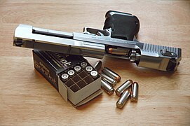 Slide locked back on a Desert Eagle pistol, showing the gas-operated rotating bolt mechanism