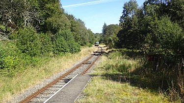 Train for Dufftown arriving at Drummuir. Drummuir railway station, Keith and Dufftown Railway. View towards Towiemore.jpg