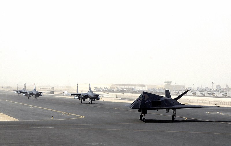 File:F-15s and F-117 taking off from Al Udeid Air Base.jpg