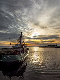 Faint winter sun on tugboat Harry in Lysekil