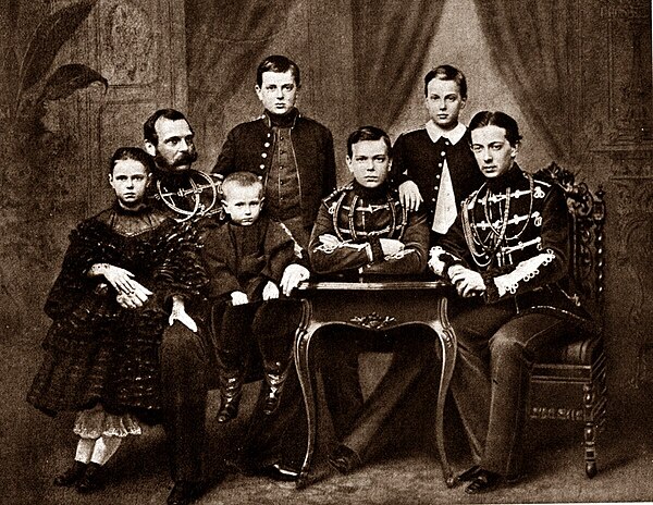 From left to right: Grand Duchess Maria Alexandrovna, Emperor Alexander II with Grand Duke Sergei Alexandrovich in his lap, Grand Duke Vladimir Alexan