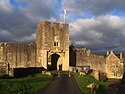 A castle made of bricks, with a road leading to it