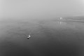 Image 944Fishing boat in the fog with the Mulholland Point Lighthouse in the background, Brunswick, Canada