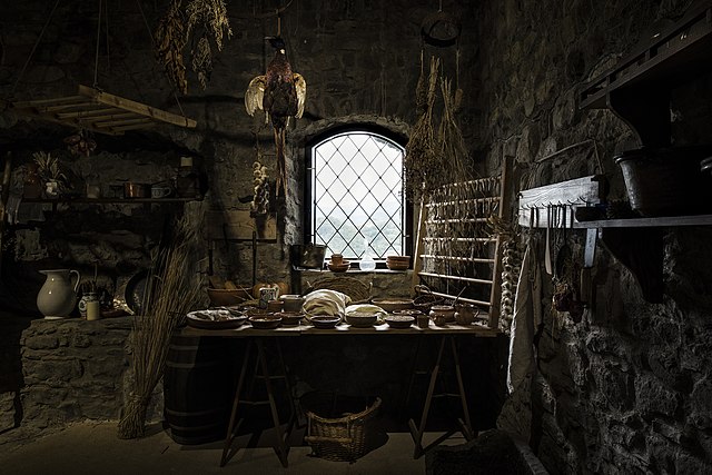 A restored medieval kitchen inside Verrucole Castle, Tuscany