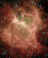 DR 6 nebula; Cygnus constellation (Spitzer Spies 'Galactic Ghoul' A "monster" lurking behind a blanket of cosmic dust is unveiled in this Halloween image from NASA's Spitzer Space Telescope. Resembling a ghoul with two hollow eyes and a screaming mouth, this masked cloud of newborn stars was uncovered by Spitzer's heat-seeking infrared eyes.