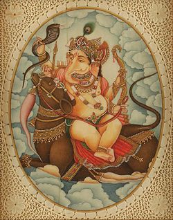 Attired in an orange dhoti, an elephant-headed man sits on a large lotus. His body is red in colour and he wears various golden necklaces and bracelets and a snake around his neck. On the three points of his crown, budding lotuses have been fixed. He holds in his two right hands the rosary (lower hand) and a cup filled with three modakas (round yellow sweets), a fourth modaka held by the curving trunk is just about to be tasted. In his two left hands, he holds a lotus above and an axe below, with its handle leaning against his shoulder.