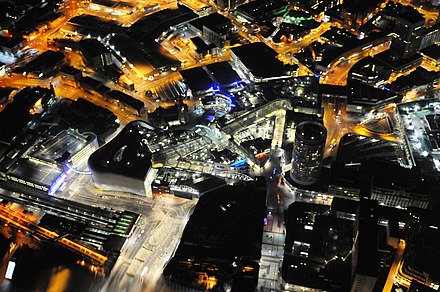 Night-time aerial view, showing Moor Street (bottom left) and New Street (centre-right) stations, separated by the BullRing shopping centre
