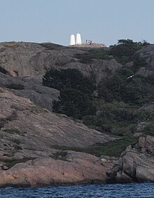 The two white cairns at Helgøya, rebuilt after World War II, was set up to make the sound recognizable from the ocean (Skagerrak).