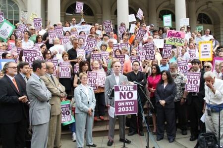 GVSHP Executive Director Andrew Berman speaks at a rally against NYU 2031 at New York City Hall.