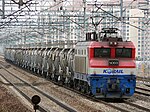 A Korail 8000 series electric locomotive pulls a freight train of tank cars in 2009