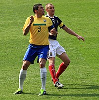 Miller (right) playing for Scotland against Lucio of Brazil in March 2011 Lucio and Kenny Miller 1.jpg