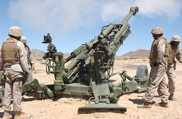 US Artillerymen fire-off an artillery round with the newly fielded M777 Lightweight 155-millimeter Howitzer