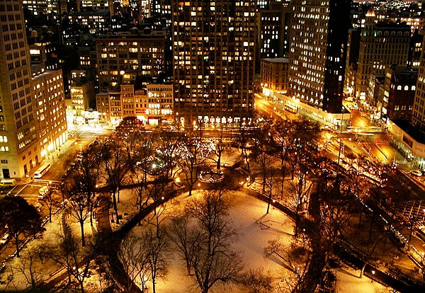 Snow-covered Madison Square Park at night, looking south (December 2005)