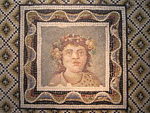 Bust of Dionysus, wearing a leopardskin and with flowers in his wreath, on a 3rd-century mosaic Mosaique - Buste de Dionysos - Palazzo Massimo.JPG