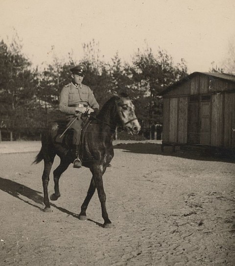 Johann Niemann riding through Lager II several months before he was killed in the revolt
