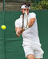 Nikoloz Basilashvili competing in the third round of the 2015 Wimbledon Qualifying Tournament at the Bank of England Sports Grounds in Roehampton, England. The winners of three rounds of competition qualify for the main draw of Wimbledon the following week.