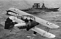 USMC Vought O2U-2 Corsairs flying past the USS Saratoga (CV-3), c. 1930. O2U-2 Corsairs of VS-14M fly over USS Saratoga (CV-3), circa 1930 (NH 94899).jpg