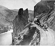 Horse drawn freight wagons on the Cariboo Road along the Thompson River, 1867 Old Cariboo Road 1867.jpg