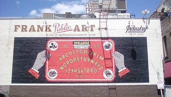 Ouija board painted on a two-story building in downtown Austin, Texas