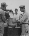 Personnel of the 892nd Chemical Company pouring Napalm.png