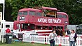 English: AEC Routemaster bus RML2292 (CUV 292C), seen being used for promotional purposes by Pimm's, in Hyde Park, London, during a music concert.