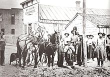Early settlers plow the road for Main Street