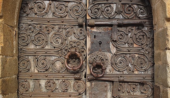 Handles at the medieval portal of "Chapelle de la Trinité de Prunet-et-Belpuig", Roussillon, France.