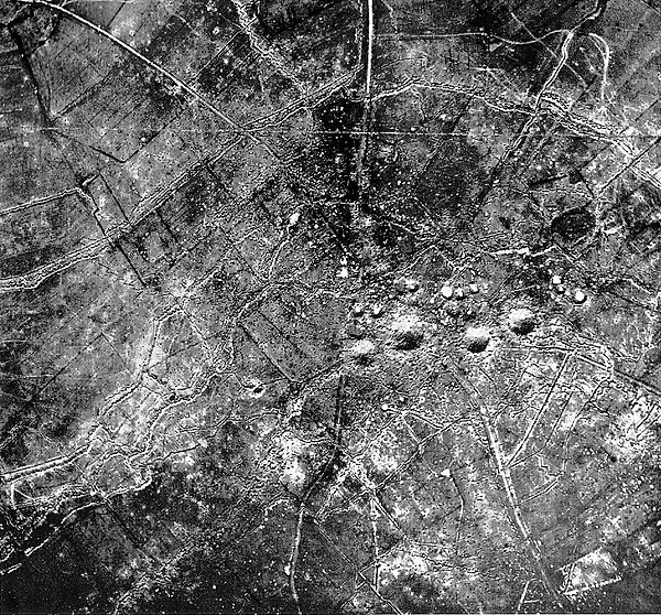 An aerial view of St Eloi, photographed on 1 April 1916. The craters created by the D2, D1, H4 and H1 mines are clearly visible.