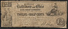 Note inscribed No. 121 Baltimore February 10, 1841 Baltimore and Ohio RAILROAD COMPANY. Transfer to the holder of this order TWELVE AND A HALF CENTS in the Stock of the City of Baltimore bearing Six per cent interest payable quarterly when said holder presents orders amounting to One Hundred Dollars or upwards. [Commissioners holding the Stock to redeem these orders]." The note is illustrated with an illustration of two standing women on the left, and one sitting woman on the right.
