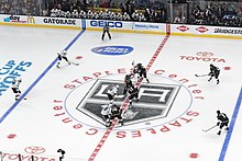 A face-off between the Kings and the San Jose Sharks, during Game 5 of the first round in the 2016 Stanley Cup playoffs.
