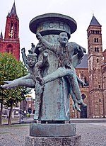 Statue at Vrijthof square Maastricht with St Servaes churches in the background - panoramio (cropped).jpg