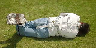 A straitjacket is a garment shaped like a jacket with long sleeves that surpass the tips of the wearer's fingers. Its most typical use is restraining people who may cause harm to themselves or others. Once the wearer slides their arms into the sleeves, the person assisting the wearer crosses the sleeves against the chest and ties the ends of the sleeves to the back of the jacket, ensuring the arms are close to the chest with as little movement as possible.