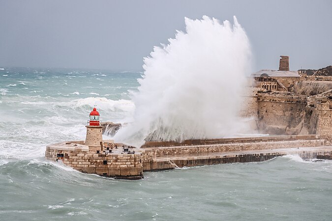 A huge wave hitting the breakwater at Fort Ricasoli, Malta by Bonavia92