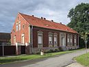 Homestead, consisting of a residential building with an extension, two stable buildings, a barn and a coach house