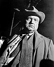 Orson Welles as Hank Quinlan