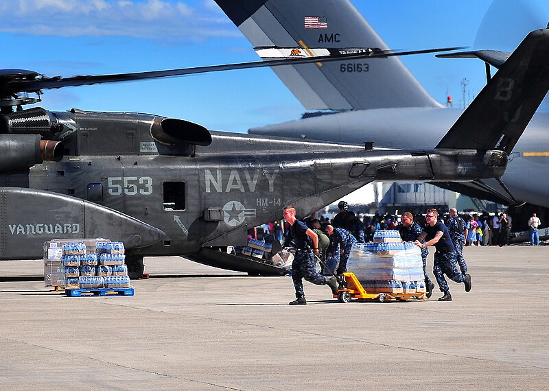 File:US Navy 100116-N-4774B-827 Sailors load bottles of fresh water into an MH-53E from Helicopter Mine Countermeasures Squadron (HM) 14 that will be delivered to earthquake survivors.jpg