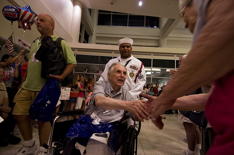 File:US Navy 110629-N-HZ247-362 A World War II veteran is greeted at Chicago Midway Airport after returning from the National World War II Memorial in W.jpg