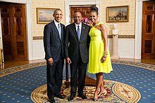 US President Barack Obama and First Lady Michelle Obama greet His Excellency Uhuru Kenyatta, President of the Republic of Kenya, in the Blue Room during a US-Africa Leaders Summit dinner at the White House, 5 August 2014. Uhuru Kenyatta with Obamas 2014.jpg