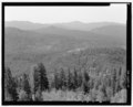 VIEW SOUTH FROM THE SOUTH CATWALK; PILOT PEAK IS THE TALLEST IN THE BACKGROUND RANGE - North Mountain Lookout, Stanislaus National Forest, Groveland, Tuolumne County, CA HABS CAL,55-GROLA.V,2-11.tif