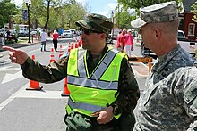 Brig. Gen. Timothy P. Williams, the Adjutant General of Virginia, speaks to a member of the Virginia Defense Force during the 2015 Apple Blossom Festival in Winchester, Virginia. Virginia Defense Force talks to National Guardsman.jpg