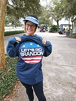 A woman wearing a shirt with the slogan